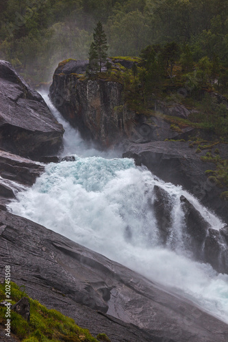 Stunning Waterfall On The Mountain River In Husedalen Valley