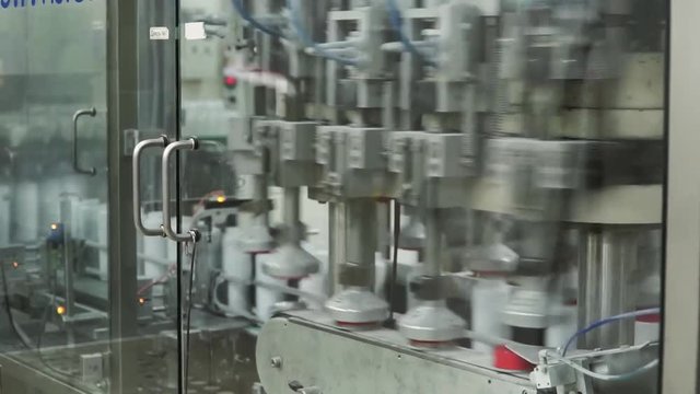 Factory for the production of medicines, glass bottles on the conveyor. Clip. For the production of plastic bottles and bottles on a conveyor belt factory