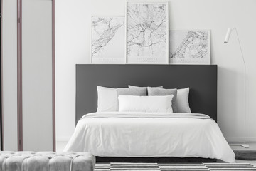 Elegant bedroom interior with maps