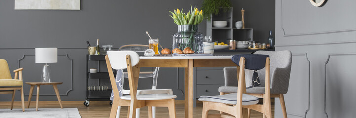 Spacious grey dining room interior