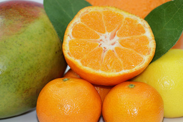 Fresh orange and mandarins with mango