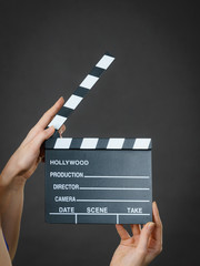 Fototapeta premium Woman holding professional film slate