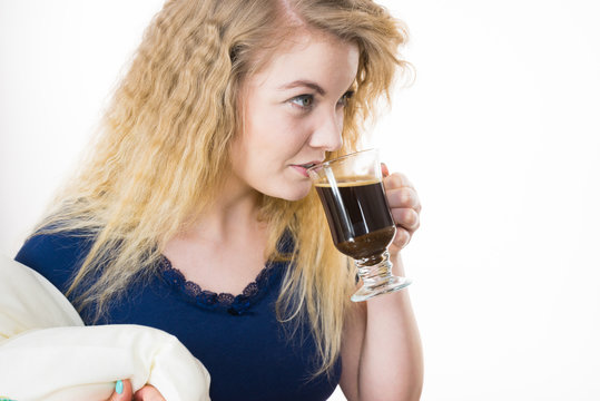 Positive woman drinking her morning coffee