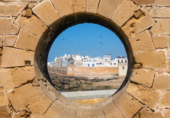 View of Essaouira through hole in wall