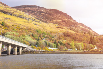 The village of Dornie, Other side of the road of Eilean Donan Castle, Dornie, Kyle of Lochalsh, Scotland At Sunrise