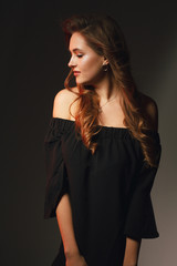 Stylish beauty portrait of a fashionable girl with makeup and hair