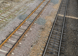 Railroad tracks on railway embankment of rubble. Three railroad tracks. Railway background