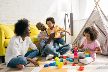 african american family spending time together at home