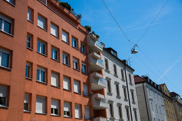 Fototapeta na wymiar Residential houses in Munich, beautiful residential area, blue sky