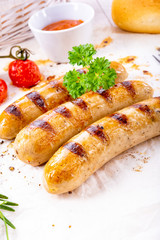 delicious bratwurst with ketchup and fresh rolls