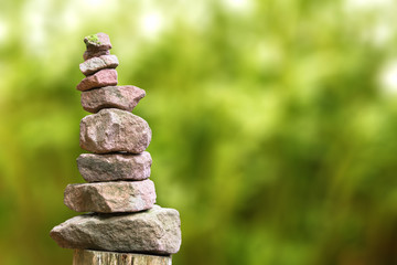 Stone pyramid in front of blurry background