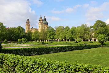 Panoramic view of the baroque Theatine church in Munich from the Hofgarten, popular Italian style park in city center