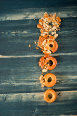Baked bread bagels on a white surface, background.