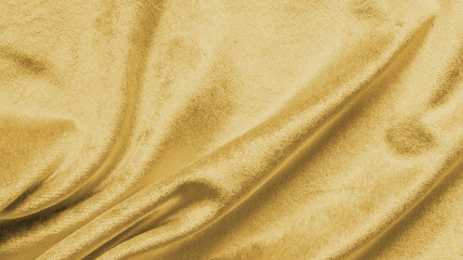 Gold velvet background or golden yellow velour flannel texture made of cotton or wool with soft fluffy velvety satin fabric cloth metallic color material