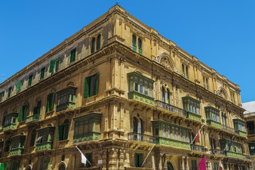 Fototapeta na wymiar Valletta, Malta Palazzo Ferreria external view. Day view of Venetian Gothic at the top of Republic Street in the capital of Malta.