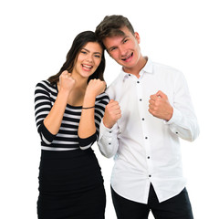 Young couple celebrating a victory on isolated white background