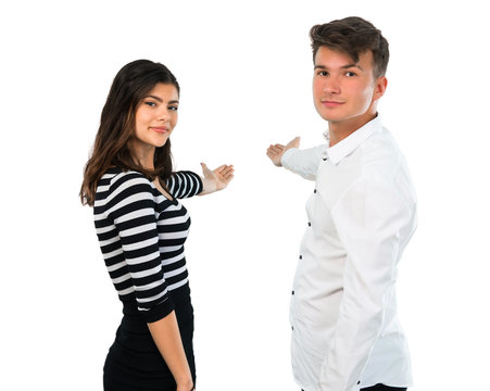 Young couplepresenting and inviting to come on isolated white background