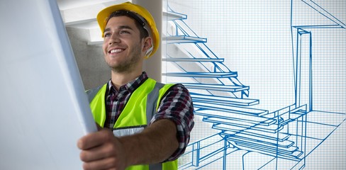 Composite image of construction worker looking at plans
