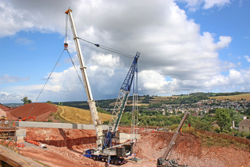 Crane lifting a bridge beam