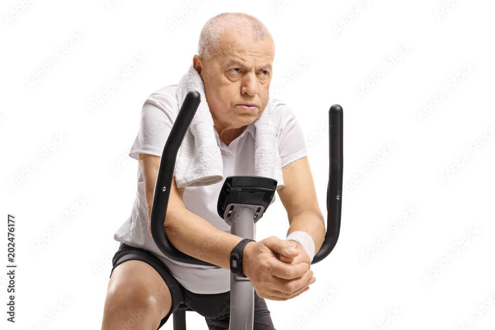 Canvas Prints exhausted senior on an exercise bike