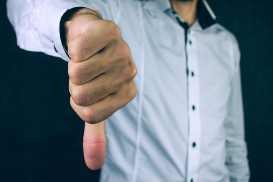 Business Man Showing Thumbs Down