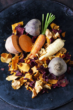 Sliced Root Vegetables And Vegetable Chips In Bowl