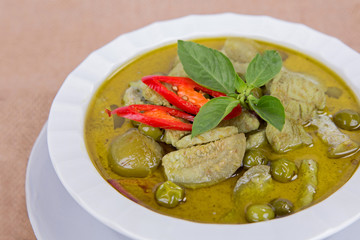 Close up green curry with chicken isolated on white background, Thai local food