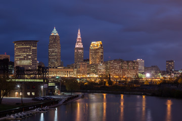 Fototapeta na wymiar Cleveland, Ohio/USA - The Cuyahoga River and Cleveland Flats at night with downtown Cleveland and the Cleveland skyline visible in the background. 