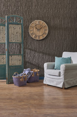 armchair blue box and living room concept wood clock brown panel background wall.