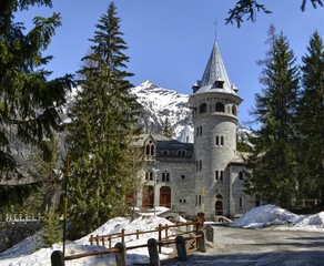 Gressoney-Saint-Jean, Valle d'Aosta region, Italy. 25 April 2018. Castel Savoia, is a villa built in the late 1800s in eclectic style. In a fairytale context, photos of the exterior. Sunny day.