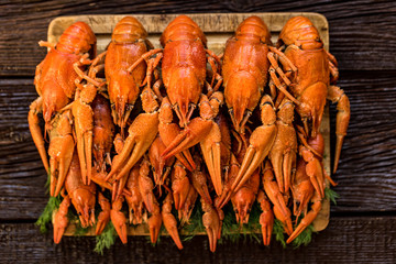Boiled crayfish on rustic wooden background