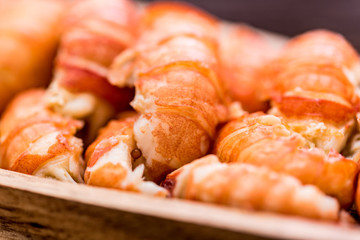 Boiled crayfish tails on rustic wooden background