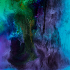 Obraz na płótnie Canvas texture with blue, purple and green paint swirls, looks like space