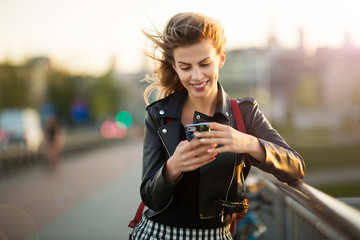 Young woman using mobile phone outdoors
