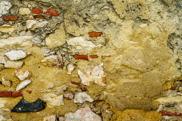 stone wall covered with clay plaster. Vintage architectural panoramic background