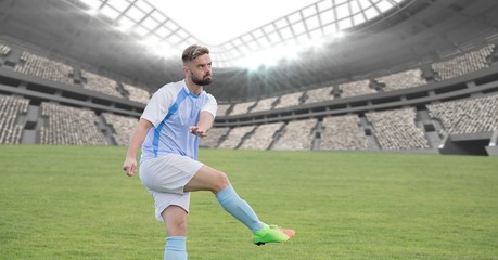 Soccer player on grass in stadium