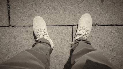 Top view of Sport Shoes with stone road background