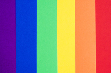 word gay on colorful colored paprers concept of LGBT rights lesbian gay bisexual transgender. Rainbow flag symbol.