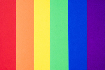 word gay on colorful colored paprers concept of LGBT rights lesbian gay bisexual transgender. Rainbow flag symbol.