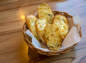 Garlic bread and herb with cheese in the basket