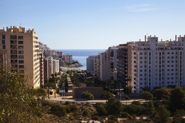 Alley to the sea. Benidorm. High-rise buildings.