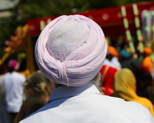 sikh man with pink turban during the religious ceremony called N
