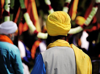 Sikh man with yellow turban and long black beard