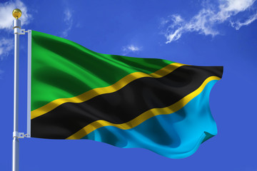 The silk waving flag of Tanzania with a flagpole on a blue sky background with clouds .3D illustration.