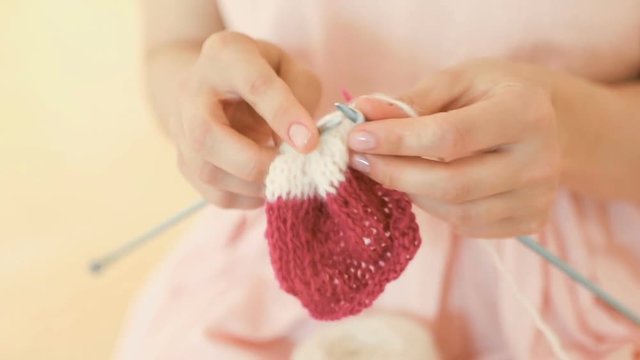 knitting hand made hobby. Young woman hands with coll hipster tattoo working. Crochet knitting. Soft daylight. Video footage. DSLR camera