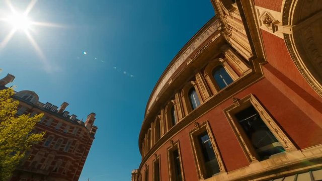 Spectacular ultra wide rotating shot of the Royal Albert Hall in London, England, UK with a beautiful sun flare