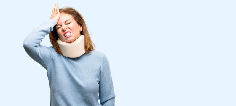 Injured Woman Wearing Neck Brace Collar Terrified And Nervous Expressing Anxiety And Panic Gesture, Overwhelmed Isolated Blue Background