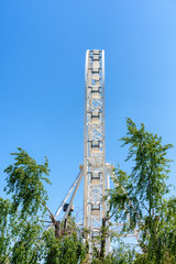 a large white Ferris wheel for the entertainment of people