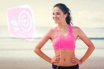 Beautiful smiling healthy with earphones on beach against fitness interface