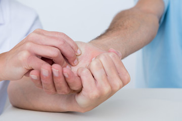 Doctor doing hand massage